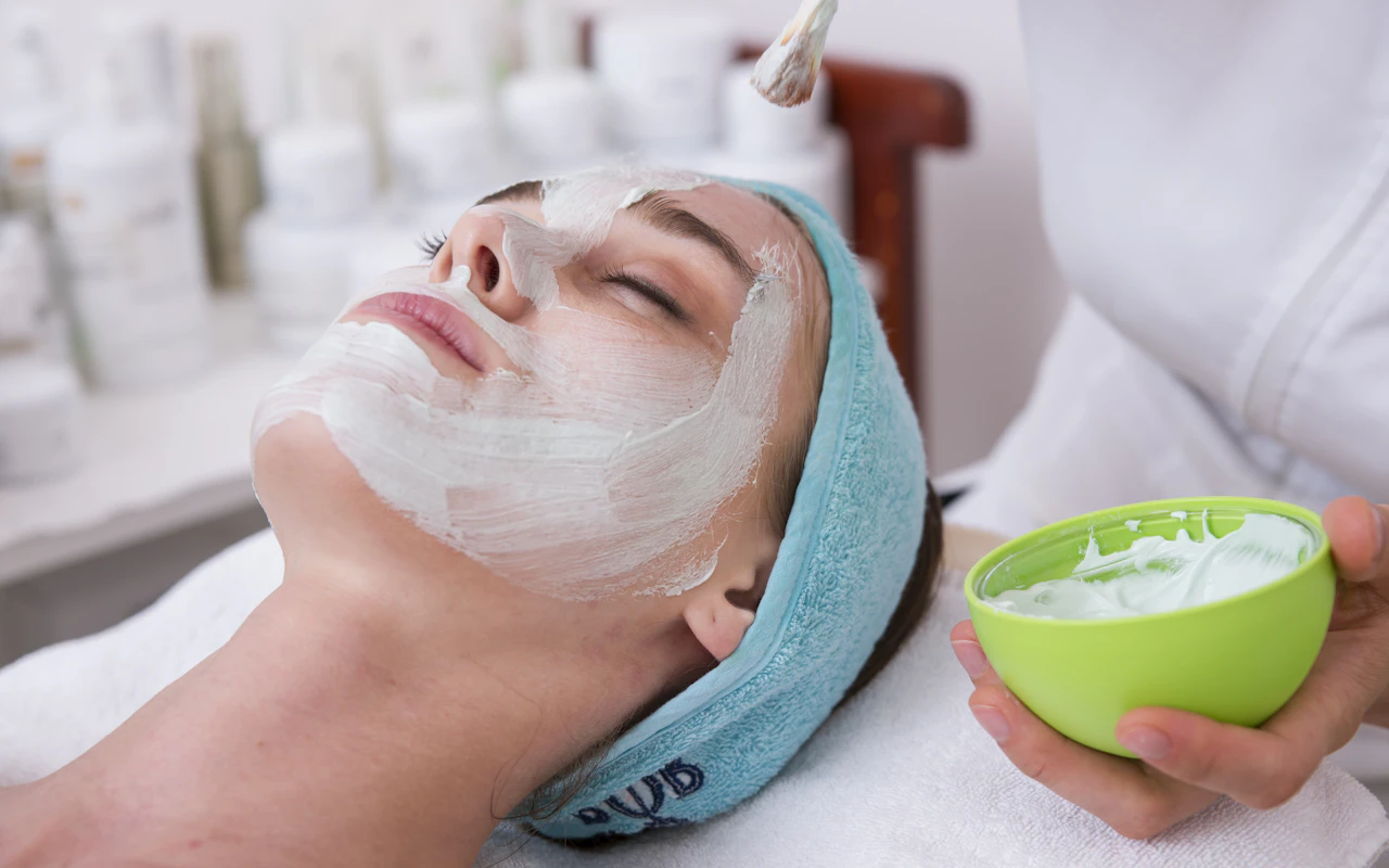 Woman resting with cream on her face