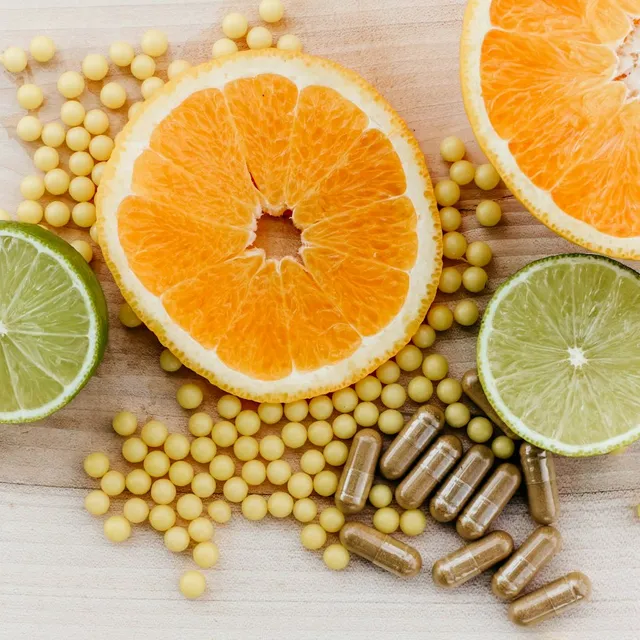 Citrus slices and natural supplement capsules