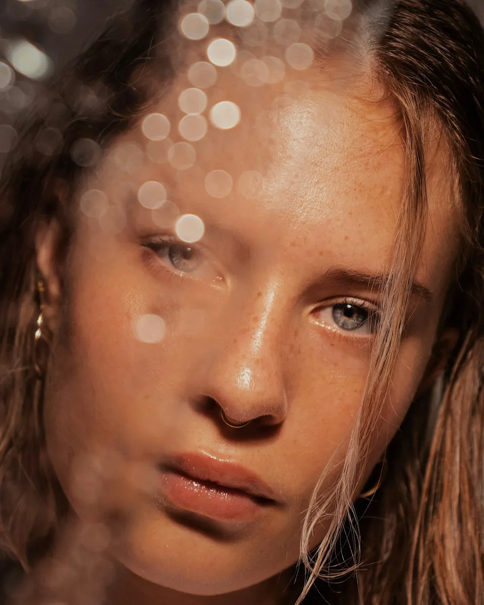 Woman with glowing skin and light on her face