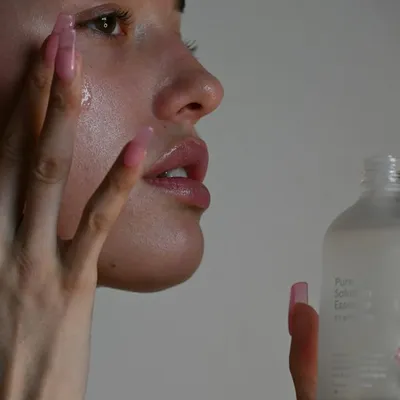 Natural skincare bottles with stones and sprigs