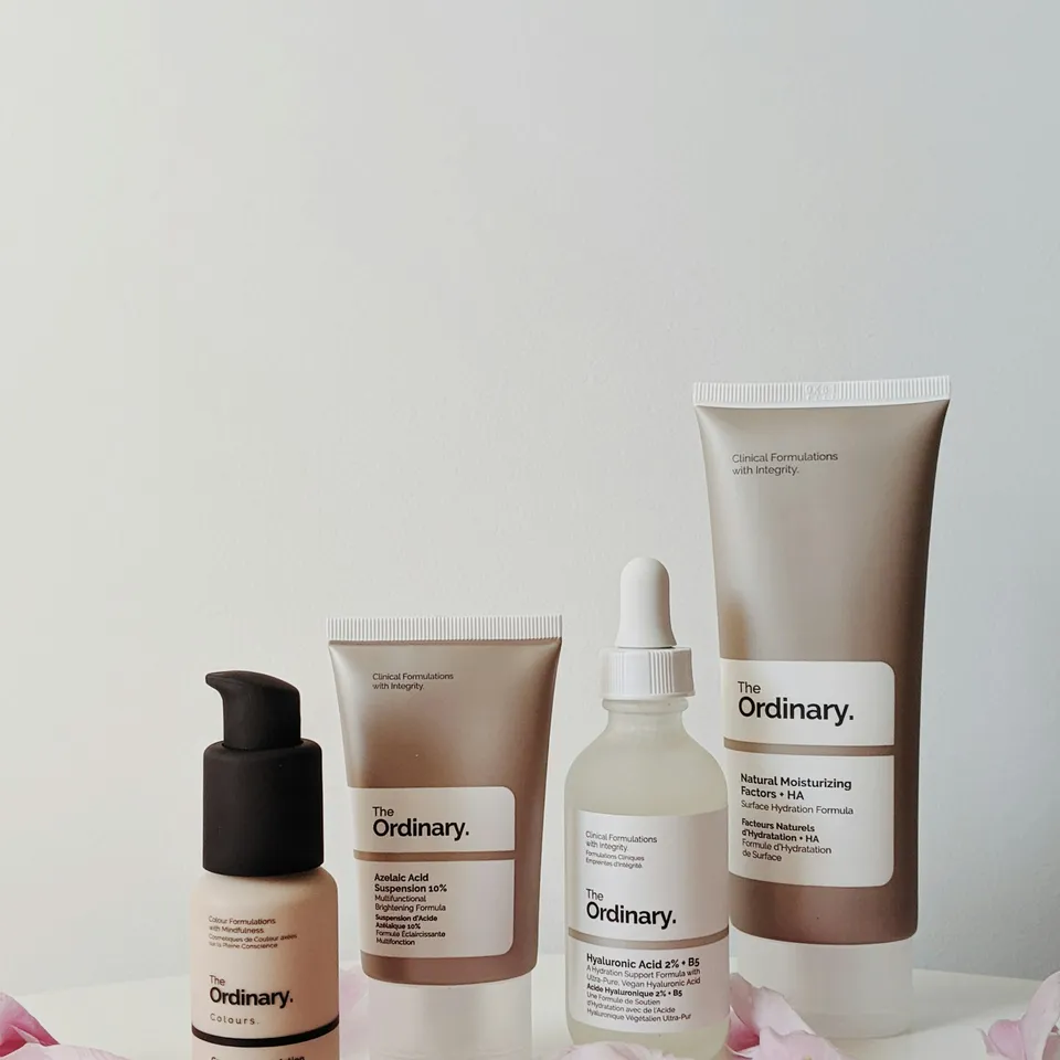 Skincare bottles and tubes arranged on a shelf
